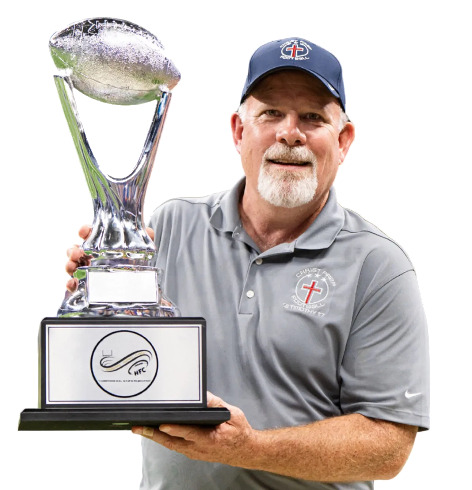 Christ Prep Football's head coach holding the championship trophy